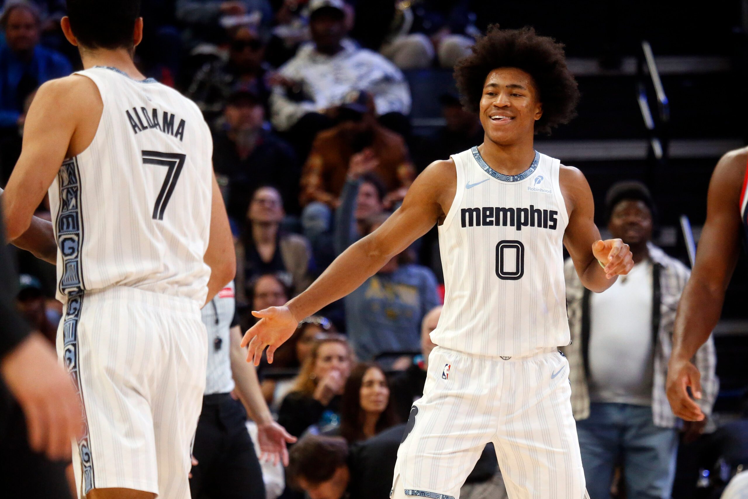 Dec 5, 2025; Memphis, Tennessee, USA; Memphis Grizzlies forward Jaylen Wells (0) reacts with forward Santi Aldama (7) during the third quarter against the Los Angeles Clippers at FedExForum. Mandatory Credit: Petre Thomas-Imagn Images