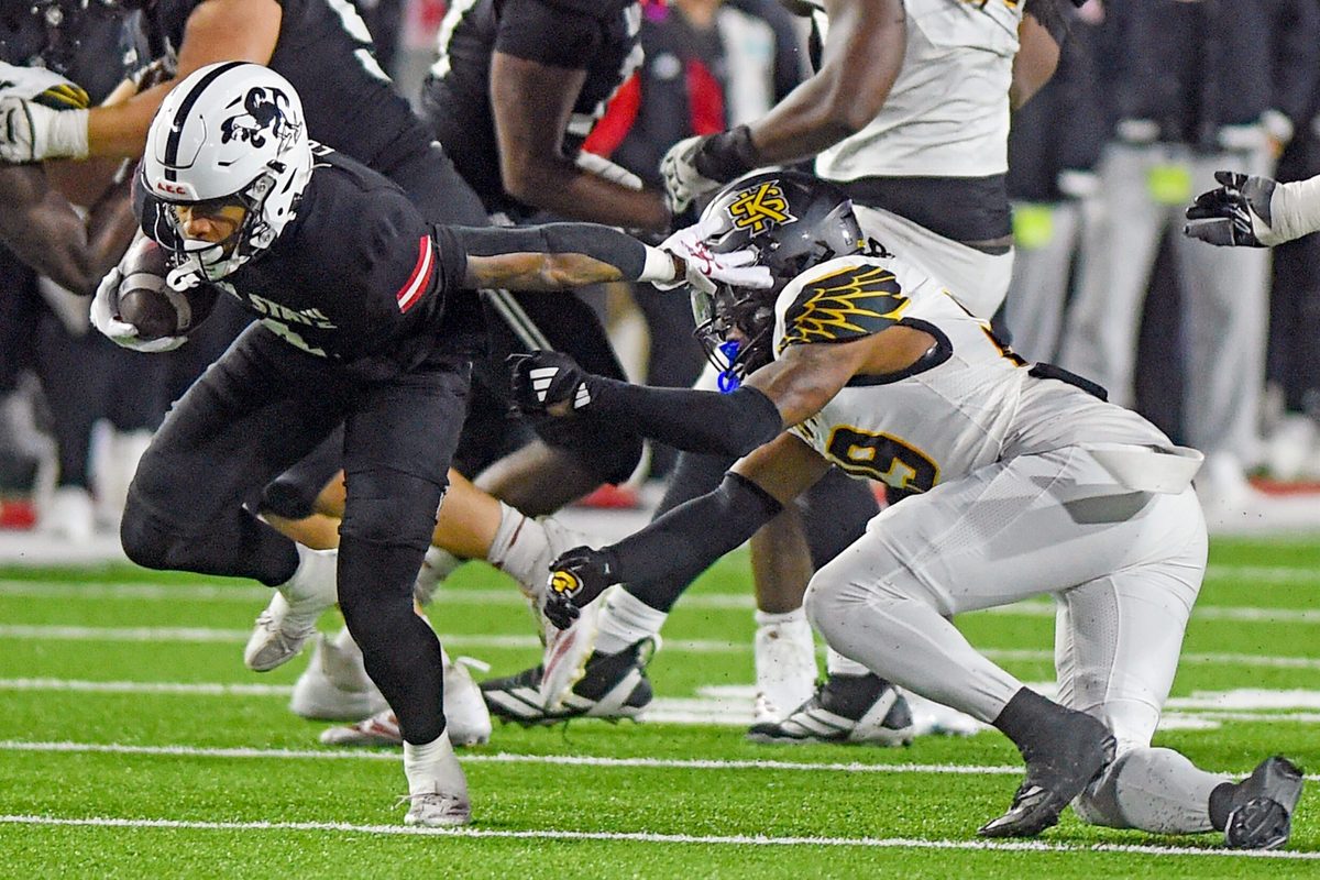 Jax State's Cam Cook tries to evade the tackle of Kennesaw State's Milon Jones during the C-USA Championship at AmFirst Stadium in Jacksonville, Alabama December 5, 2025. (Dave Hyatt / Hyatt Media LLC)