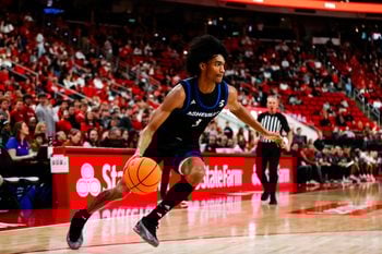 Dec 6, 2025; Raleigh, North Carolina, USA; UNC Asheville Bulldogs guard Kameron Taylor (3) dribbles the ball during the second half of the game against NC State Wolfpack at Lenovo Center. Mandatory Credit: Jaylynn Nash-Imagn Images