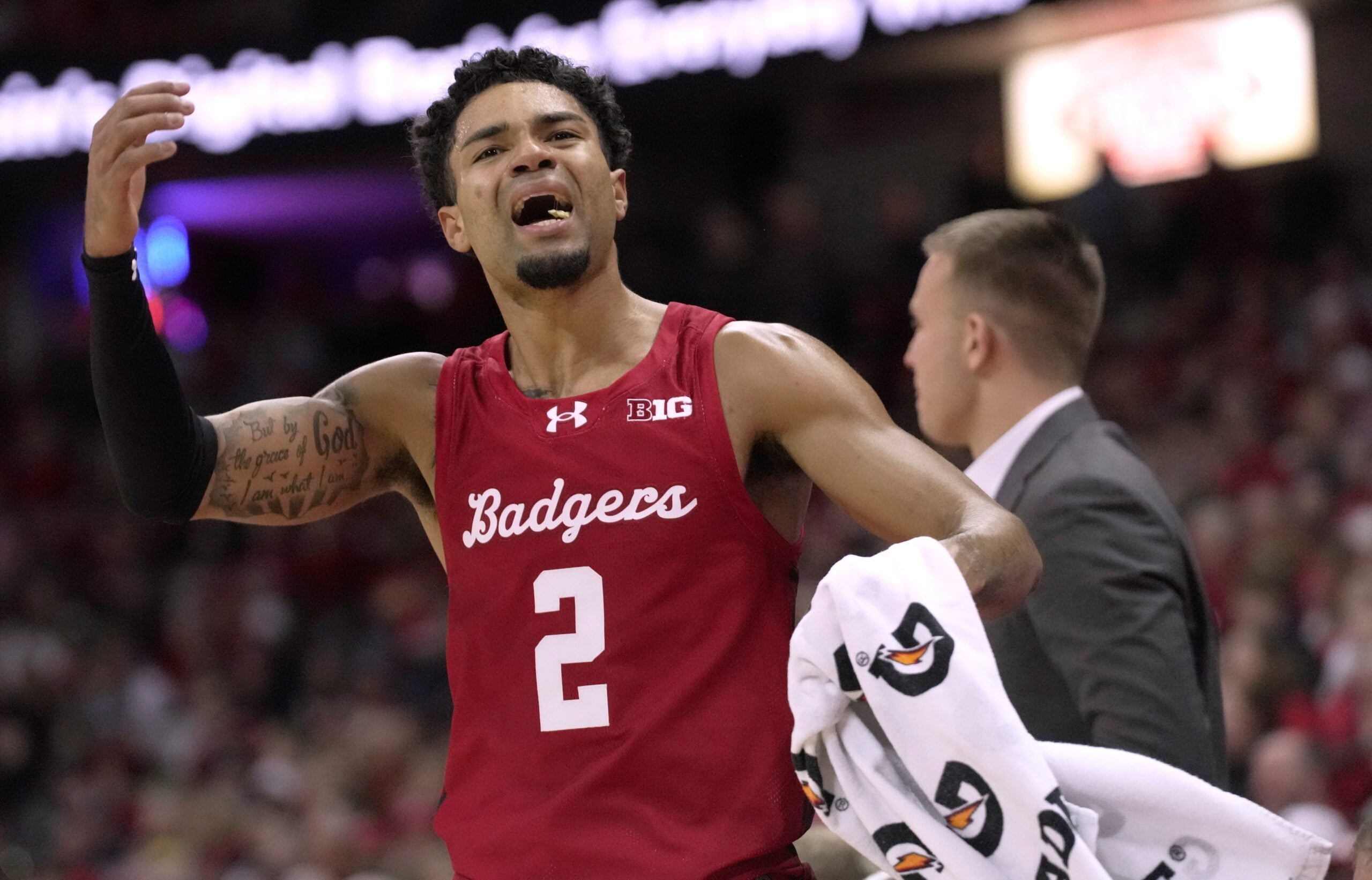 Wisconsin guard Nick Boyd (2) tries to fire up the crowd during the second half of their game Saturday, December 6, 2025 at the Kohl Center in Madison, Wisconsin. Wisconsin beat Marquette 96-76.