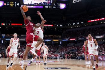 Indiana Hoosiers guard Lamar Wilkerson (3) shoots the ball over Louisville Cardinals guard Ryan Conwell (3) during a game Saturday, Dec. 6, 2025, at Gainbridge Fieldhouse in Indianapolis. Louisville defeated Indiana 87-78.