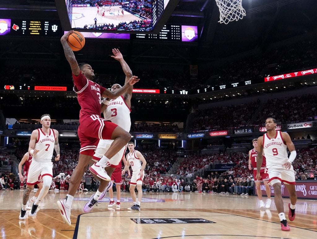 Indiana Hoosiers guard Lamar Wilkerson (3) shoots the ball over Louisville Cardinals guard Ryan Conwell (3) during a game Saturday, Dec. 6, 2025, at Gainbridge Fieldhouse in Indianapolis. Louisville defeated Indiana 87-78.