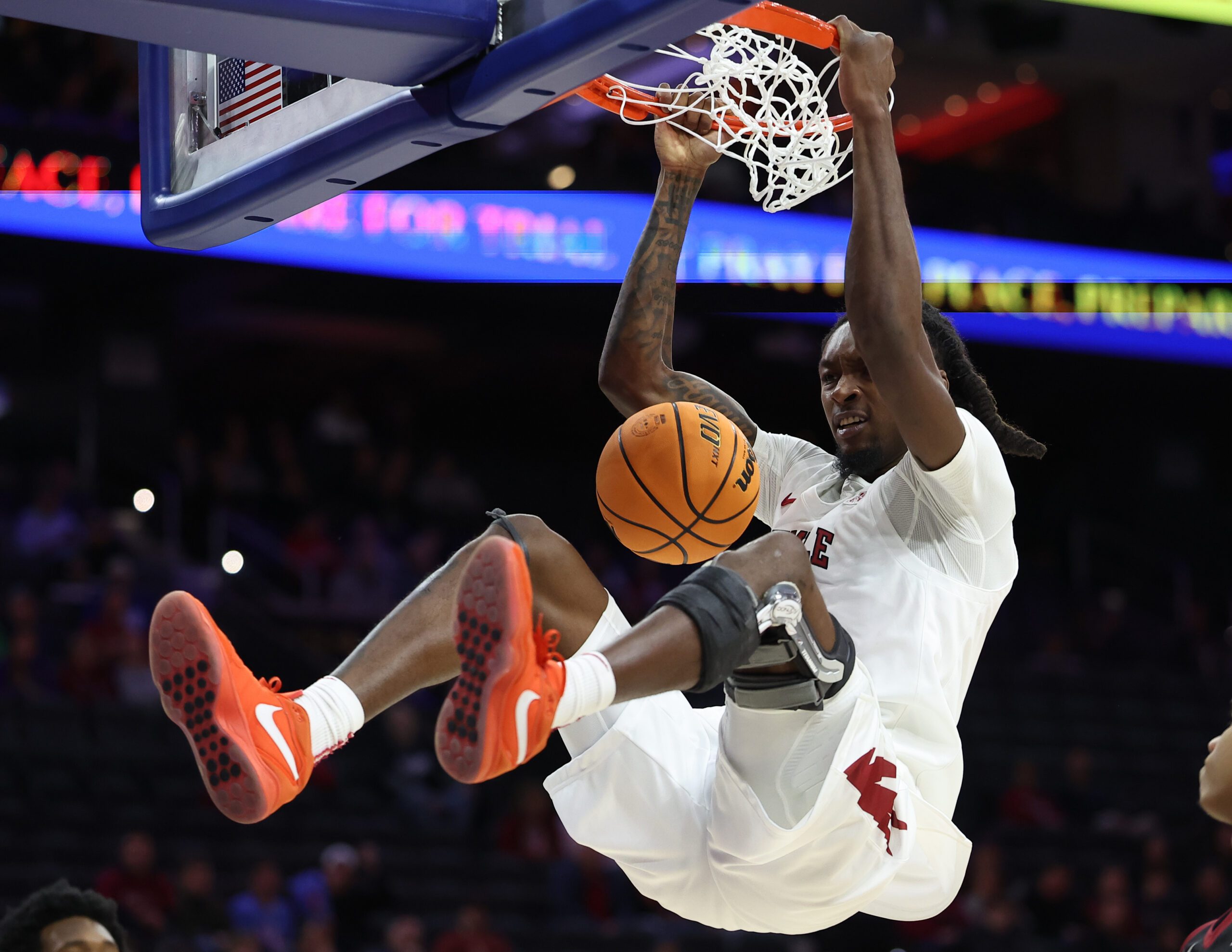 Dec 6, 2025; Philadelphia, PA, USA; Temple Owls forward Jamai Felt (1) dunks the ball against the Saint Joseph's Hawks during the second half at Xfinity Mobile Arena. Mandatory Credit: Bill Streicher-Imagn Images