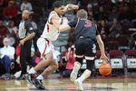 Dec 6, 2025; North Little Rock, Arkansas, USA; Arkansas Razorbacks guard Darius Acuff Jr (5) defends during the second half against Fresno State Bulldogs guard Jake Heidbreder (3) at Simmons Bank Arena. Arkansas won 82-58. Mandatory Credit: Nelson Chenault-Imagn Images