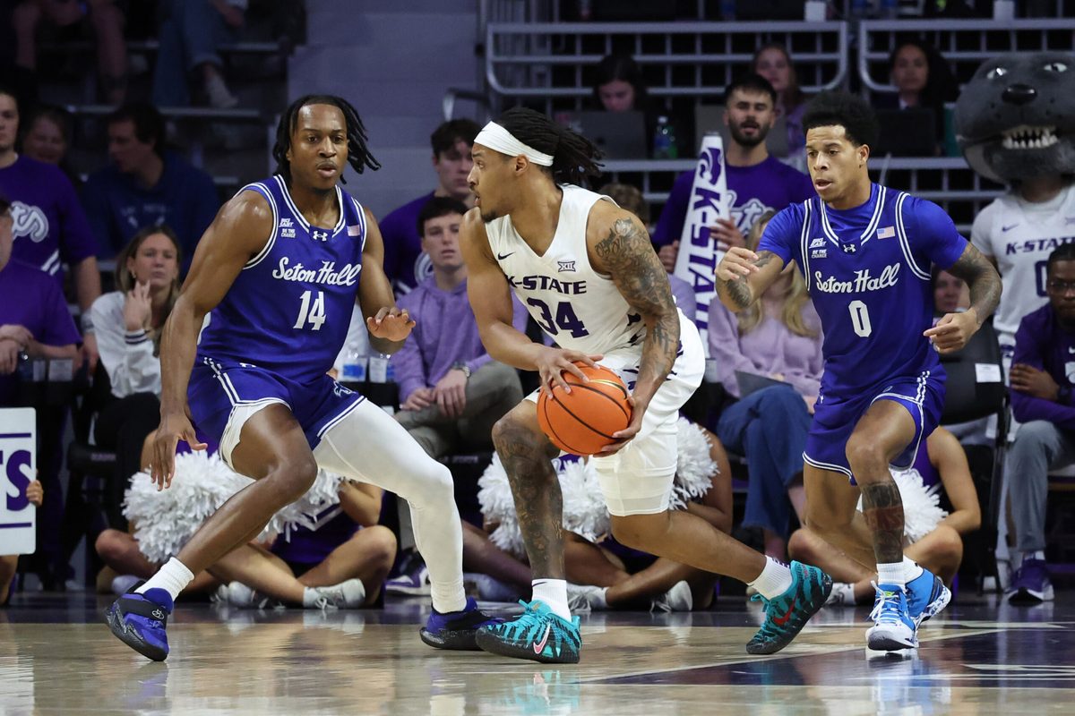Dec 6, 2025; Manhattan, Kansas, USA; Kansas State Wildcats guard Nate Johnson (34) is guarded by Seton Hall Pirates guards AJ Staton-McCray (14) and Adam Clark (0) during the first half at Bramlage Coliseum. Mandatory Credit: Scott Sewell-Imagn Images