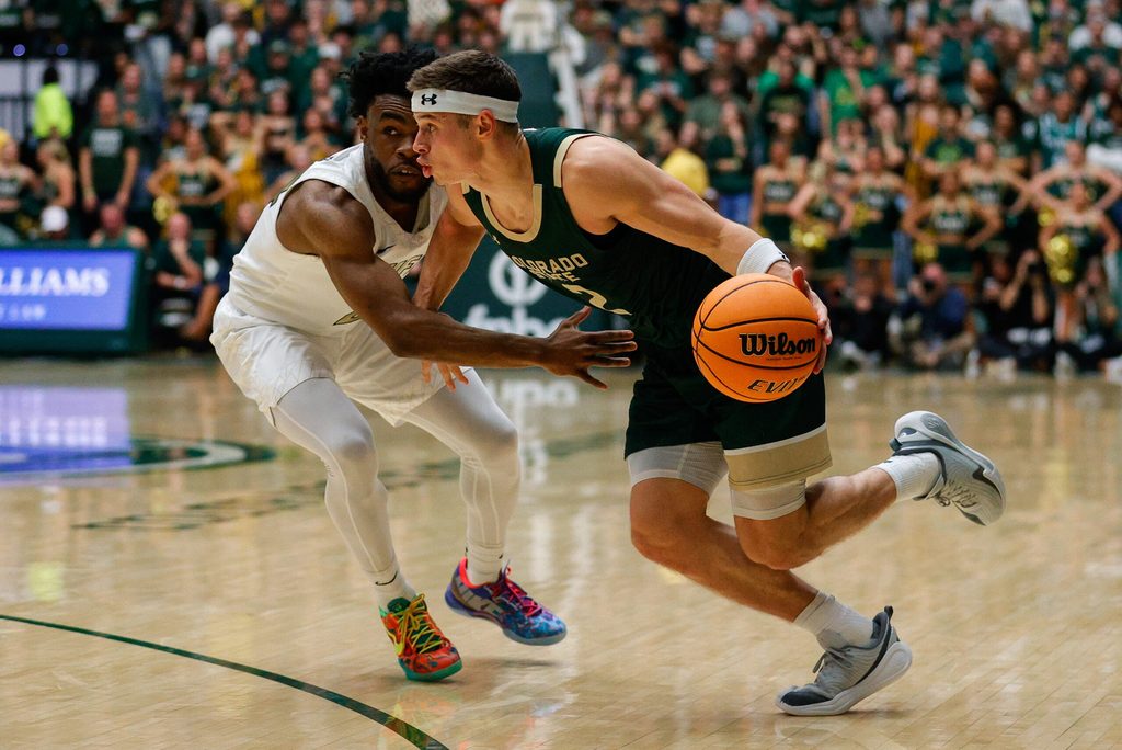 Dec 6, 2025; Fort Collins, Colorado, USA; Colorado State Rams guard Brandon Rechsteiner (2) controls the ball as Colorado Buffaloes guard Barrington Hargress (24) guards in the second half at Moby Arena. Mandatory Credit: Isaiah J. Downing-Imagn Images