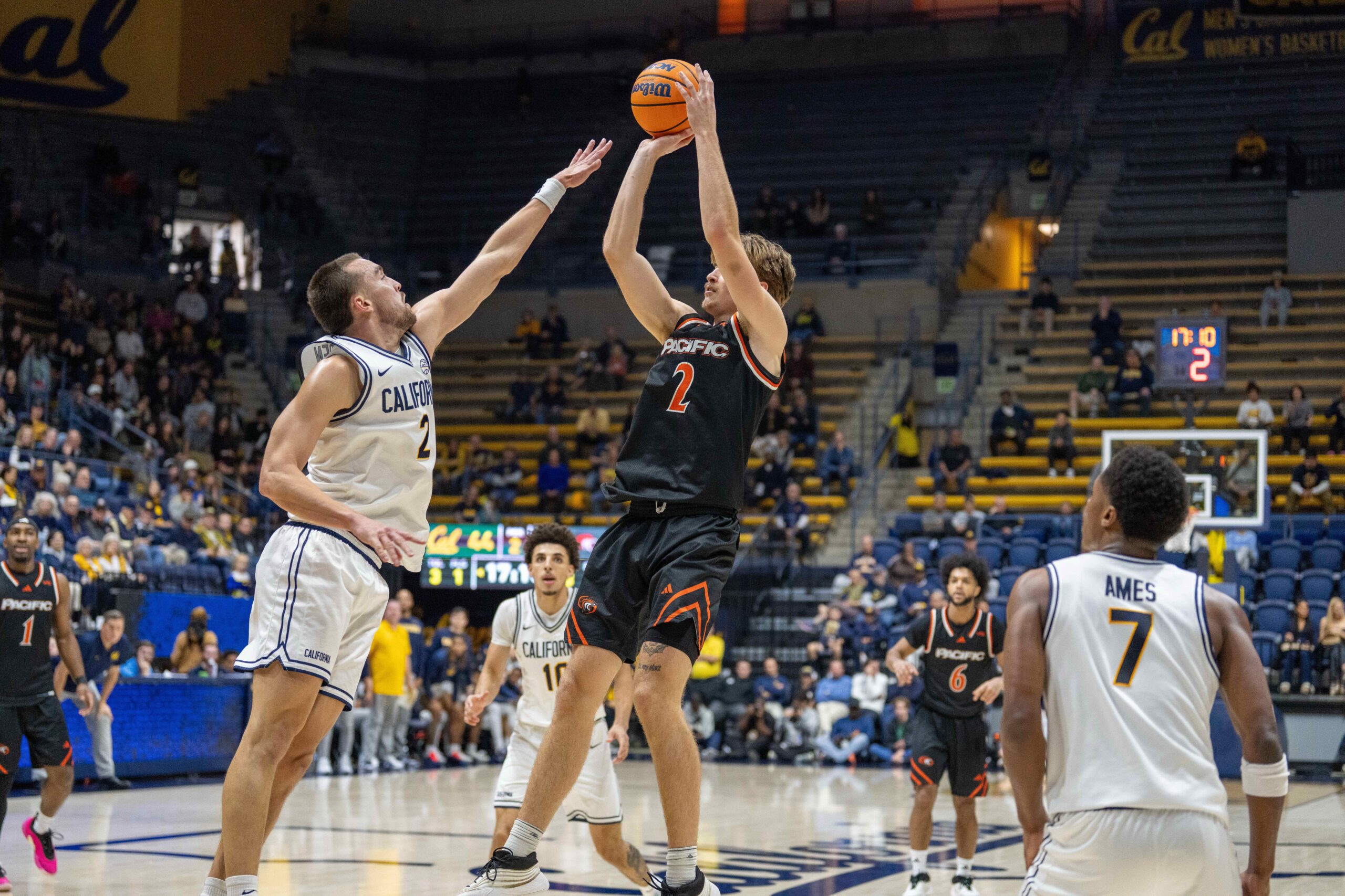 Dec 6, 2025; Berkeley, California, USA; Pacific Tigers forward Elias Ralph (2) shoots the basketball while being defended by California Golden Bears forward John Camden (2) during the second half at Haas Pavilion. Mandatory Credit: Neville E. Guard-Imagn Images