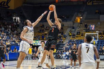 Dec 6, 2025; Berkeley, California, USA; Pacific Tigers forward Elias Ralph (2) shoots the basketball while being defended by California Golden Bears forward John Camden (2) during the second half at Haas Pavilion. Mandatory Credit: Neville E. Guard-Imagn Images
