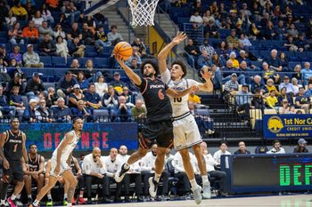 Dec 6, 2025; Berkeley, California, USA; Pacific Tigers guard Jaden Clayton (6) shoots the layup against California Golden Bears guard Justin Pippen (10) during the second half at Haas Pavilion. Mandatory Credit: Neville E. Guard-Imagn Images
