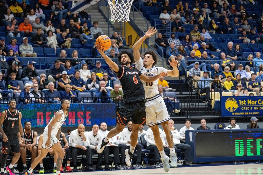 Dec 6, 2025; Berkeley, California, USA; Pacific Tigers guard Jaden Clayton (6) shoots the layup against California Golden Bears guard Justin Pippen (10) during the second half at Haas Pavilion. Mandatory Credit: Neville E. Guard-Imagn Images