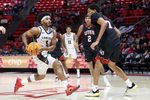 Dec 6, 2025; Salt Lake City, Utah, USA; California Baptist Lancers guard Dominique Daniels Jr. (1) drives to the basket against Utah Utes forward Josh Hayes (7) during the first half at Jon M. Huntsman Center. Mandatory Credit: Rob Gray-Imagn Images