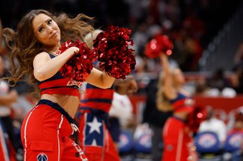 Dec 6, 2025; Washington, District of Columbia, USA; A member of the Washington Wizards Dancers dances during a timeout against the Atlanta Hawks in the second half at Capital One Arena. Mandatory Credit: Geoff Burke-Imagn Images