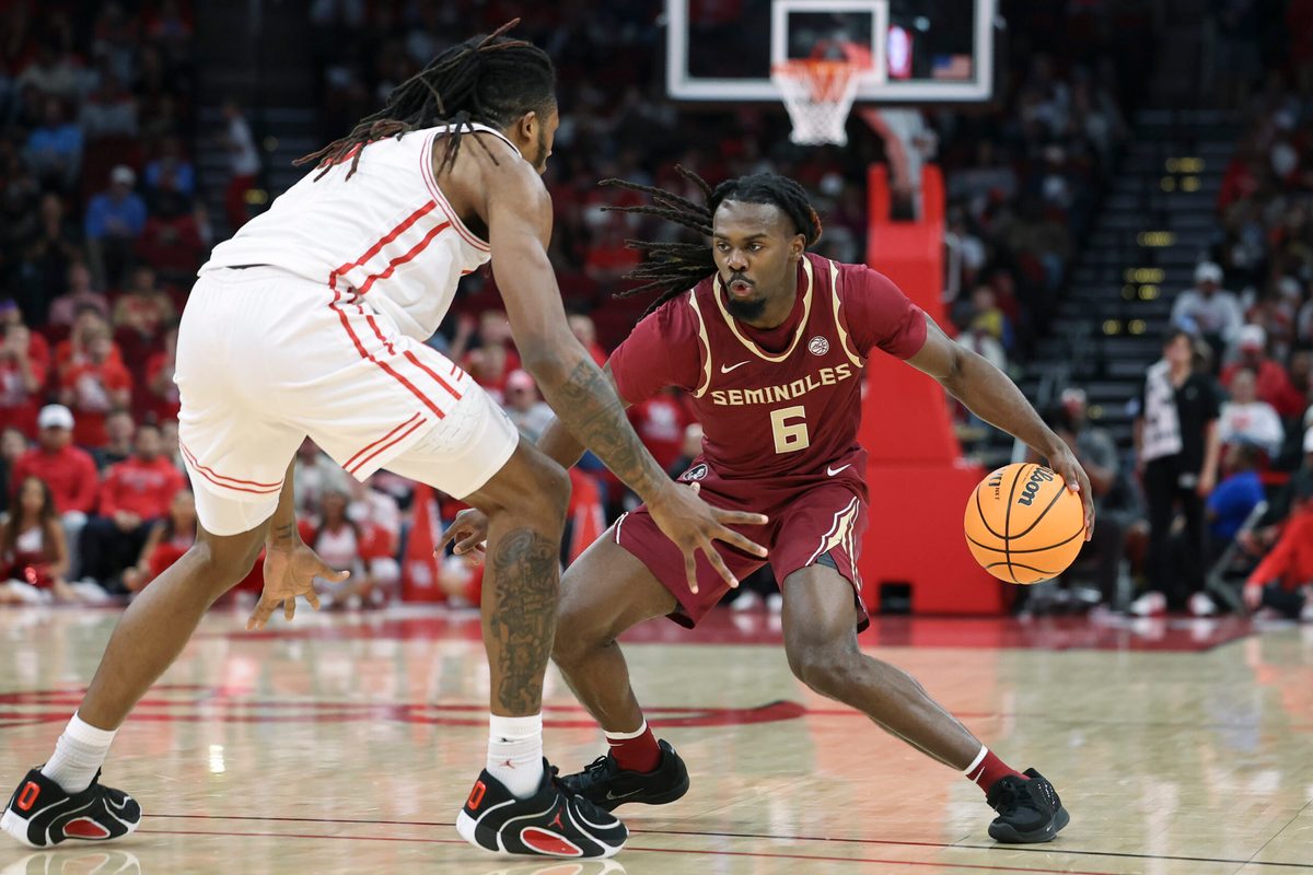 Dec 6, 2025; Houston, TX, USA; Florida State Seminoles guard Robert McCray V (6) dribbles the ball as Houston Cougars forward Joseph Tugler (11) defends during the second half at Toyota Center. Mandatory Credit: Troy Taormina-Imagn Images