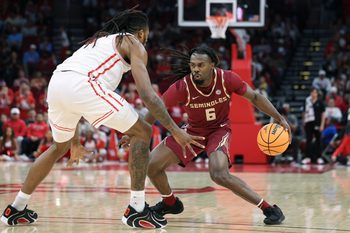 Dec 6, 2025; Houston, TX, USA; Florida State Seminoles guard Robert McCray V (6) dribbles the ball as Houston Cougars forward Joseph Tugler (11) defends during the second half at Toyota Center. Mandatory Credit: Troy Taormina-Imagn Images
