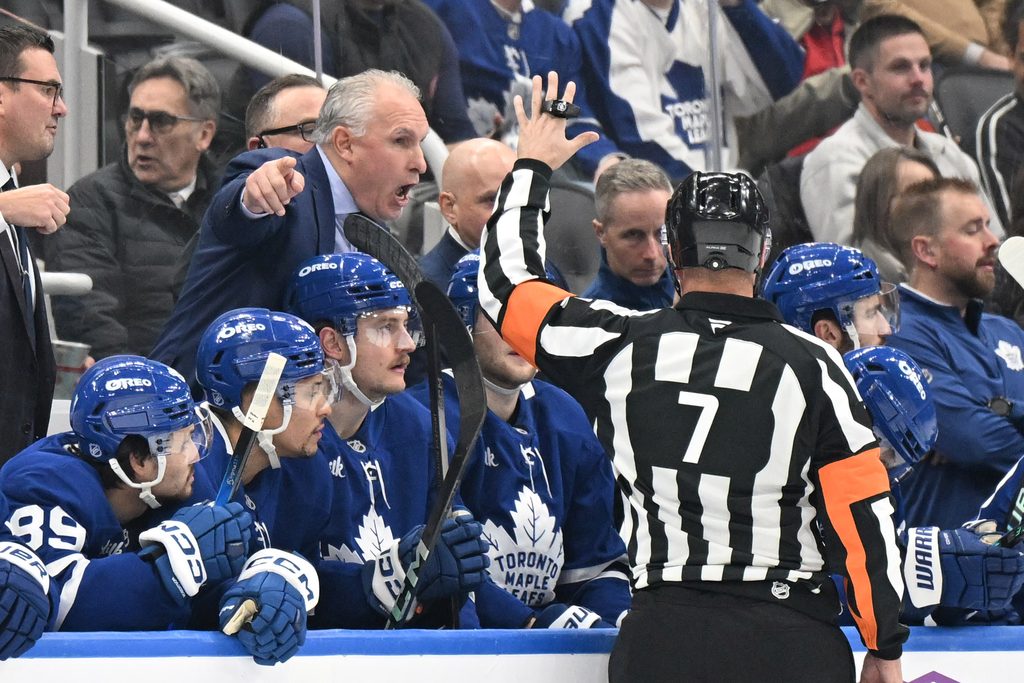 Dec 6, 2025; Toronto, Ontario, CAN; Toronto Maple Leafs head coach Craig Berube gestures as he speaks to referee Garrett Rank (7) in the first period at Scotiabank Arena. Mandatory Credit: Dan Hamilton-Imagn Images