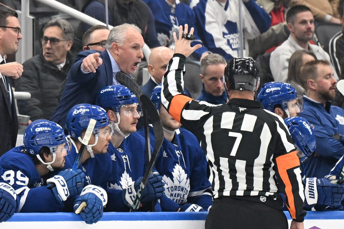 Dec 6, 2025; Toronto, Ontario, CAN; Toronto Maple Leafs head coach Craig Berube gestures as he speaks to referee Garrett Rank (7) in the first period at Scotiabank Arena. Mandatory Credit: Dan Hamilton-Imagn Images