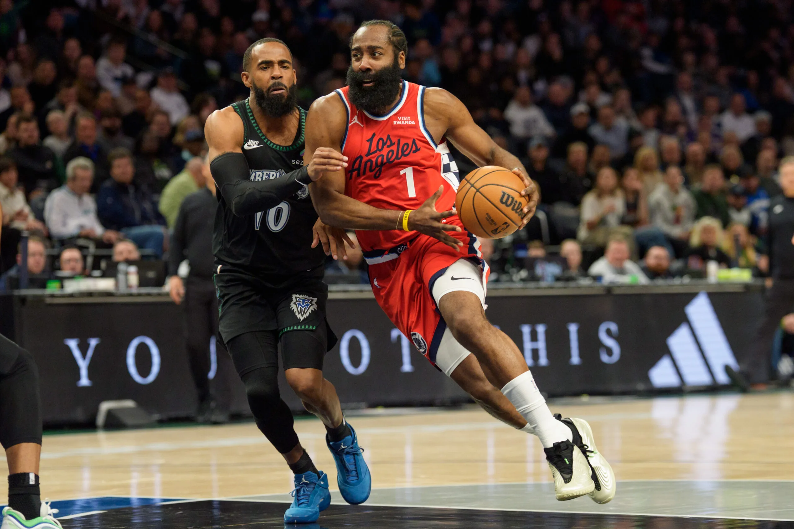 Dec 6, 2025; Minneapolis, Minnesota, USA; LA Clippers guard James Harden (1) drives on Minnesota Timberwolves guard Mike Conley (10) in the third quarter at Target Center. Mandatory Credit: Matt Blewett-Imagn Images