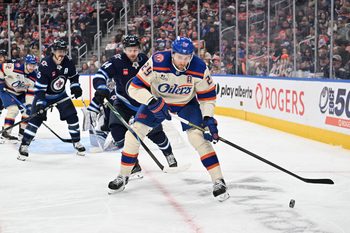 Dec 6, 2025; Edmonton, Alberta, CAN; Edmonton Oilers center Leon Draisaitl (29) goes for the puck with Winnipeg Jets defenseman Josh Morrissey (44) during the third period at Rogers Place. Mandatory Credit: Walter Tychnowicz-Imagn Images