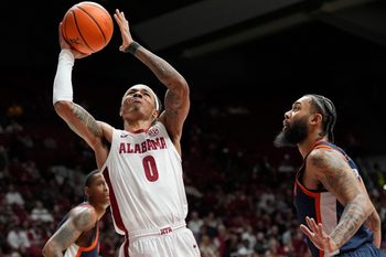 Dec 7, 2025; Tuscaloosa, AL, USA; Alabama guard Labaron Philon Jr. (0) goes to the basket against UTSA guard Jamir Simpson (7) at Coleman Coliseum. Mandatory Credit: Gary Cosby Jr.-Tuscaloosa News