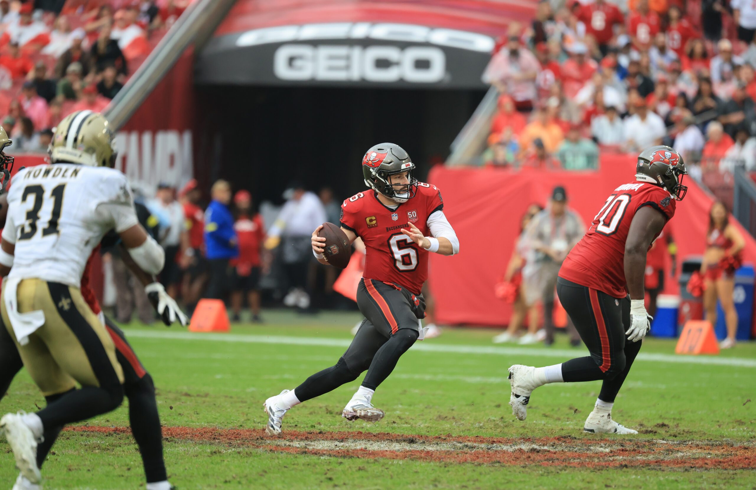 Dec 7, 2025; Tampa, Florida, USA; Tampa Bay Buccaneers quarterback Baker Mayfield (6) runs for a gain during the fourth quarter against the New Orleans Saints at Raymond James Stadium. Mandatory Credit: Kim Klement Neitzel-Imagn Images
