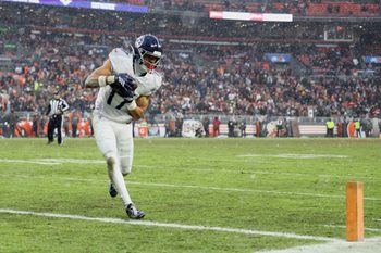 Dec 7, 2025; Cleveland, Ohio, USA; Tennessee Titans wide receiver Chimere Dike (17) catches a five-yard touchdown pass thrown by quarterback Cam Ward (not pictured) against the Cleveland Browns during the fourth quarter at Huntington Bank Field. Mandatory Credit: Scott Galvin-Imagn Images