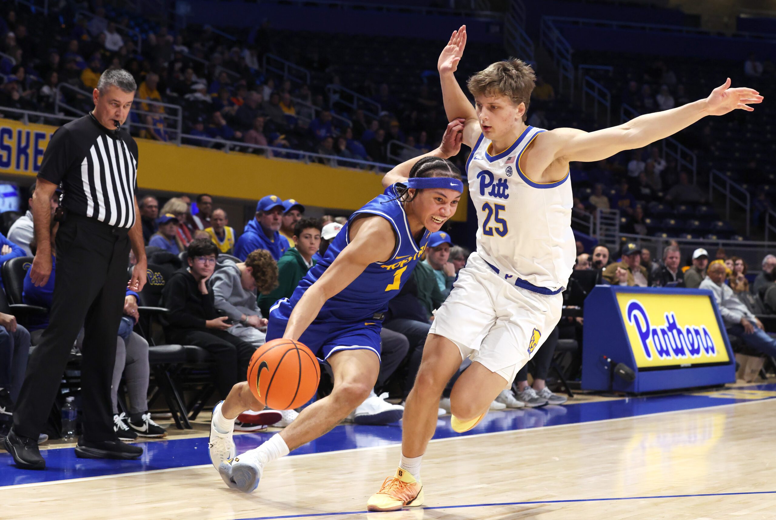 Dec 7, 2025; Pittsburgh, Pennsylvania, USA; Hofstra Pride guard Preston Edmead (1) drives to the basket as Pittsburgh Panthers guard Nojus Indrusaitis (25) defends during the second half at the Petersen Events Center. Mandatory Credit: Charles LeClaire-Imagn Images