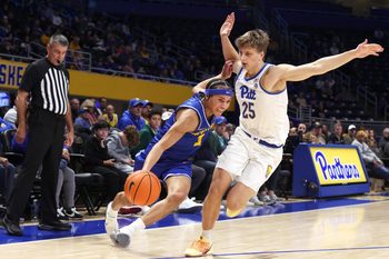 Dec 7, 2025; Pittsburgh, Pennsylvania, USA; Hofstra Pride guard Preston Edmead (1) drives to the basket as Pittsburgh Panthers guard Nojus Indrusaitis (25) defends during the second half at the Petersen Events Center. Mandatory Credit: Charles LeClaire-Imagn Images
