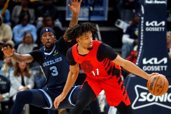 Dec 7, 2025; Memphis, Tennessee, USA; Portland Trail Blazers guard Shaedon Sharpe (17) dribbles as Memphis Grizzlies forward Kentavious Caldwell-Pope (3) defends during the third quarter at FedExForum. Mandatory Credit: Petre Thomas-Imagn Images