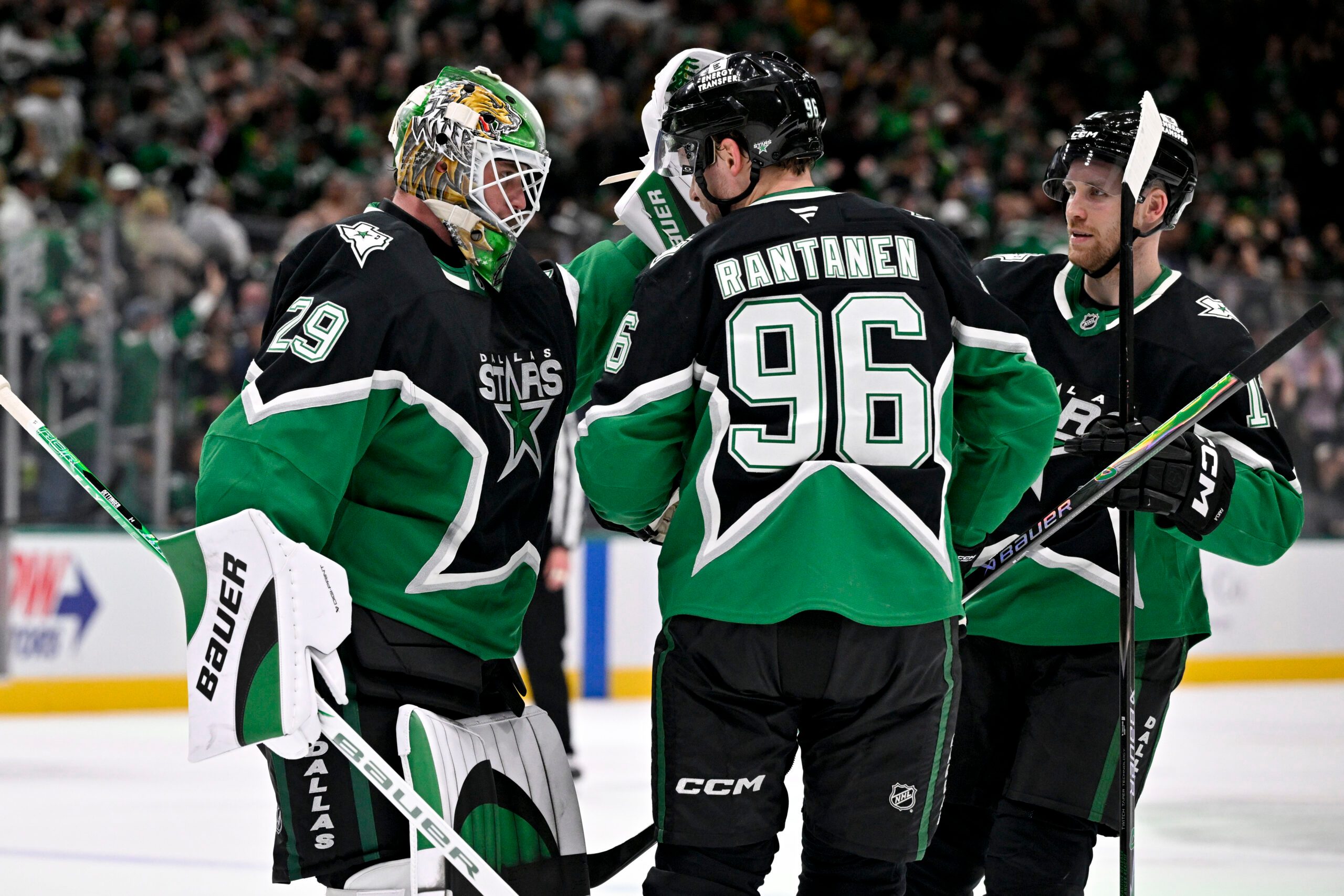 Dec 7, 2025; Dallas, Texas, USA; Dallas Stars goaltender Jake Oettinger (29) and right wing Mikko Rantanen (96) and center Radek Faksa (12) celebrate after the Stars defeat the Pittsburgh Penguins at American Airlines Center. Mandatory Credit: Jerome Miron-Imagn Images