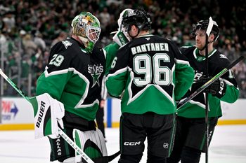Dec 7, 2025; Dallas, Texas, USA; Dallas Stars goaltender Jake Oettinger (29) and right wing Mikko Rantanen (96) and center Radek Faksa (12) celebrate after the Stars defeat the Pittsburgh Penguins at American Airlines Center. Mandatory Credit: Jerome Miron-Imagn Images