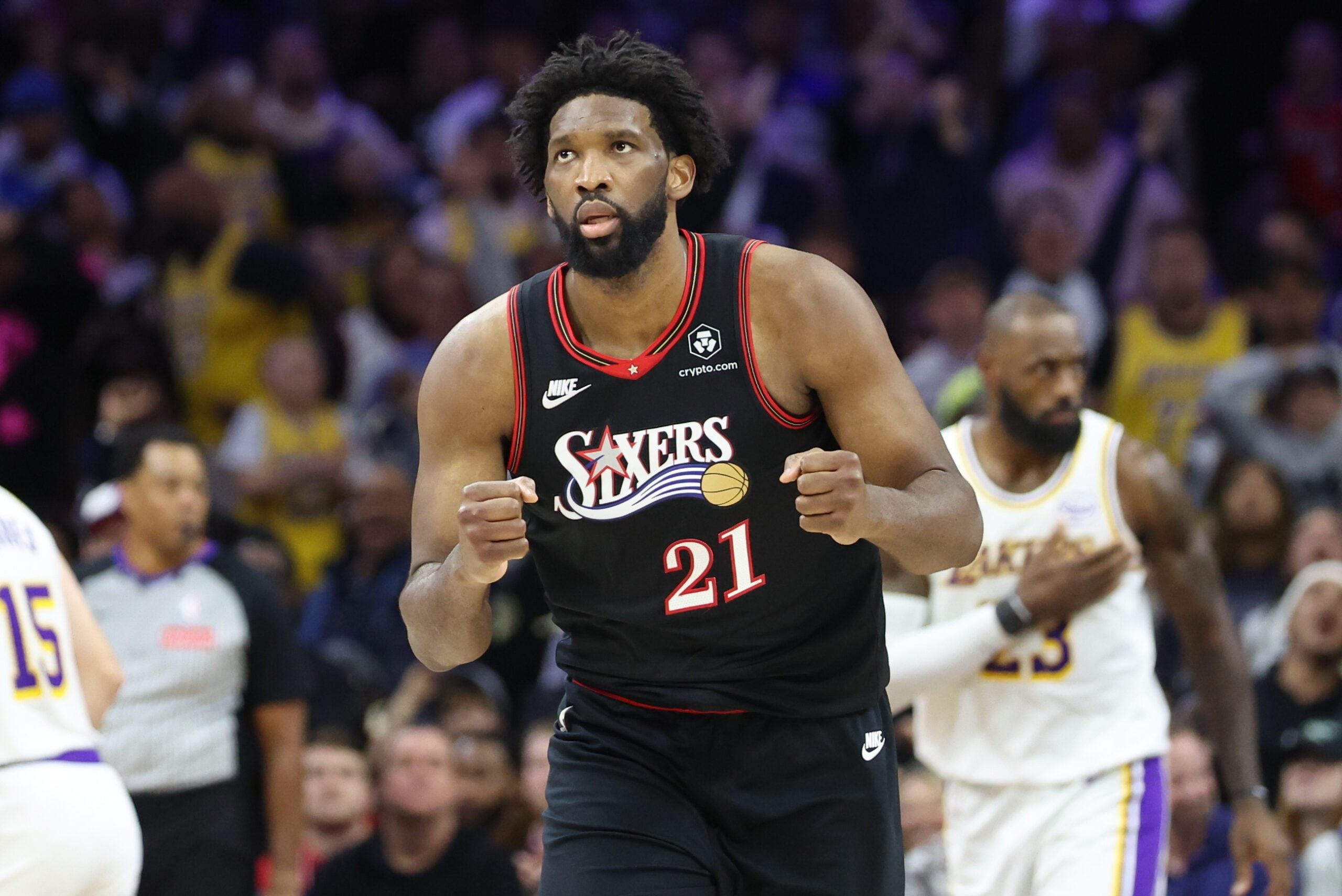 Dec 7, 2025; Philadelphia, Pennsylvania, USA; Philadelphia 76ers center Joel Embiid (21) reacts to a score against the Los Angeles Lakers during the fourth quarter at Xfinity Mobile Arena. Mandatory Credit: Bill Streicher-Imagn Images