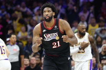 Dec 7, 2025; Philadelphia, Pennsylvania, USA; Philadelphia 76ers center Joel Embiid (21) reacts to a score against the Los Angeles Lakers during the fourth quarter at Xfinity Mobile Arena. Mandatory Credit: Bill Streicher-Imagn Images