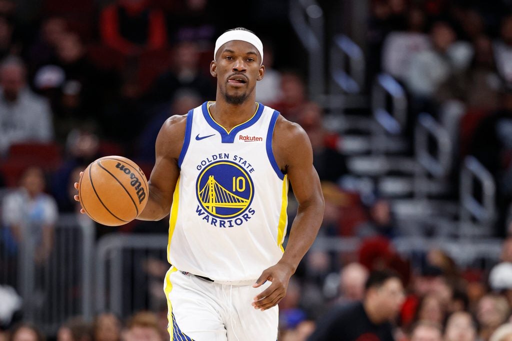 Dec 7, 2025; Chicago, Illinois, USA; Golden State Warriors forward Jimmy Butler III (10) brings the ball up court against the Chicago Bulls during the second half at United Center. Mandatory Credit: Kamil Krzaczynski-Imagn Images