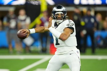 Dec 8, 2025; Inglewood, California, USA;  Philadelphia Eagles quarterback Jalen Hurts (1) passes against the Los Angeles Chargers in the first half at SoFi Stadium. Mandatory Credit: Kirby Lee-Imagn Images