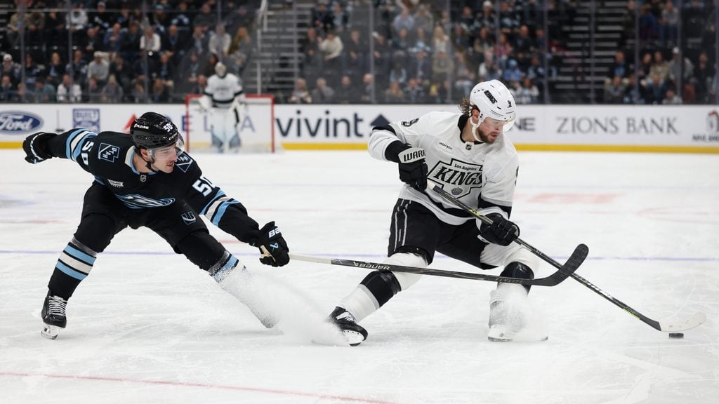 Dec 8, 2025; Salt Lake City, Utah, USA; Utah Mammoth defenseman Sean Durzi (50) and Los Angeles Kings right wing Adrian Kempe (9) play for the puck during the third period at Delta Center. Mandatory Credit: Rob Gray-Imagn Images