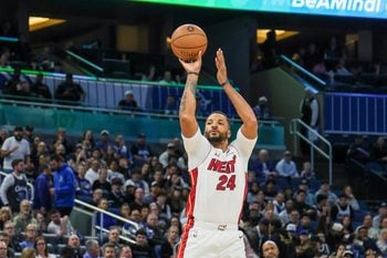 Dec 9, 2025; Orlando, Florida, USA; Miami Heat guard Norman Powell (24) shoots a three point basket during the second quarter against the Orlando Magic at Kia Center. Mandatory Credit: Mike Watters-Imagn Images