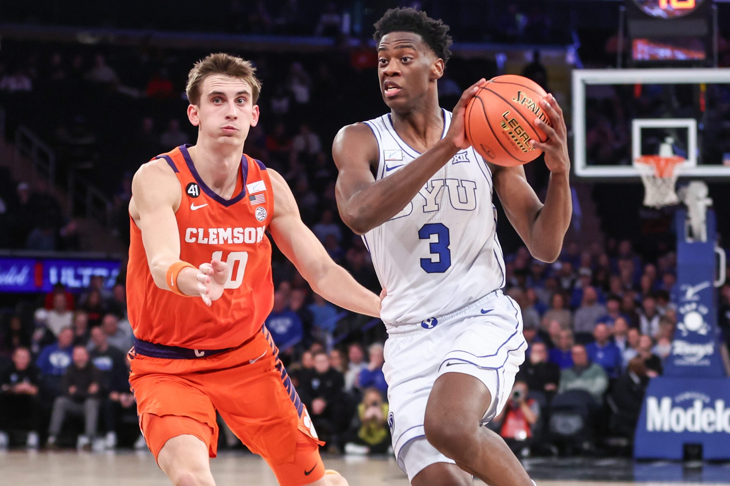 Dec 9, 2025; New York, New York, USA;  BYU Cougars forward AJ Dybantsa (3) drives past Clemson Tigers forward Jake Wahlin (10) in the first half at Madison Square Garden. Mandatory Credit: Wendell Cruz-Imagn Images