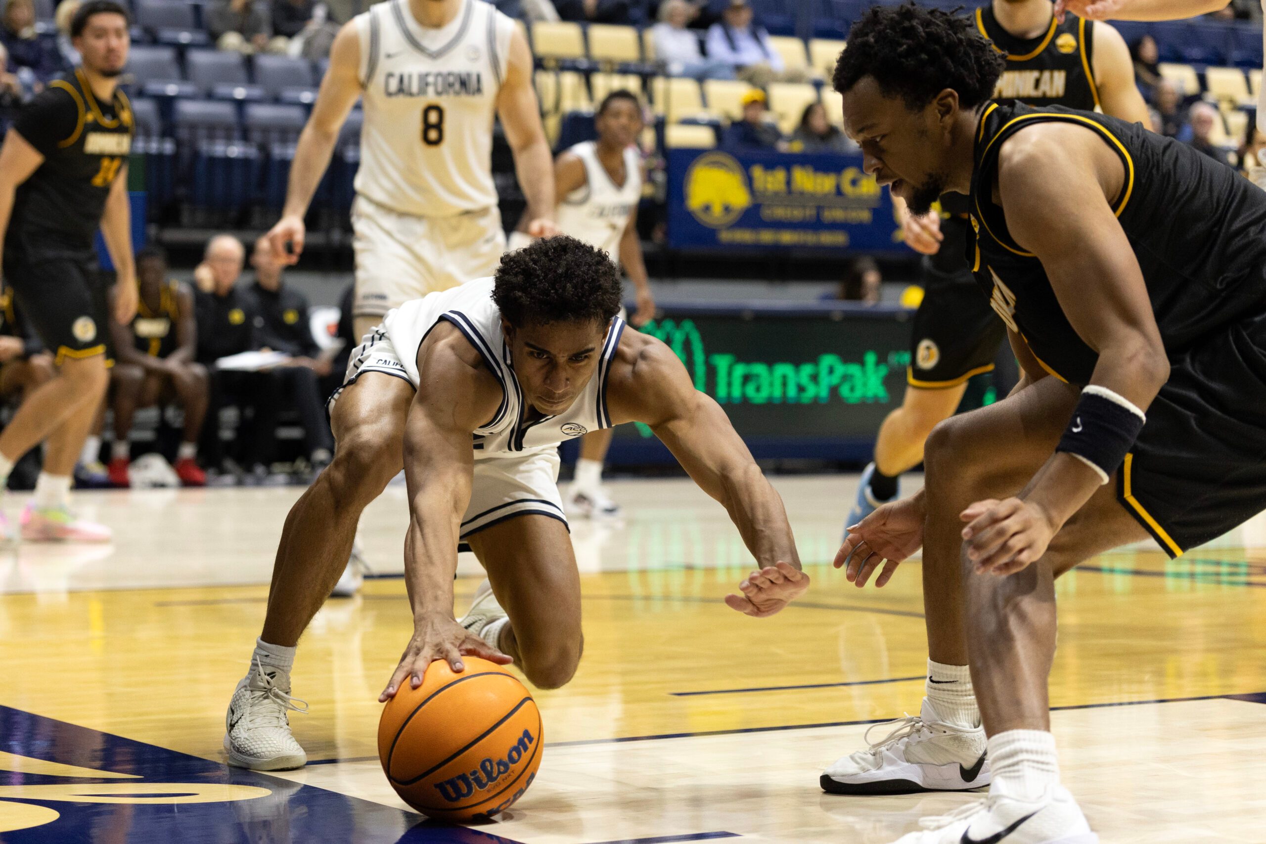 Dec 9, 2025; Berkeley, California, USA; California Golden Bears guard Semetri (TT) Carr (3) and Dominican Penguins forward Sargent Jeffery (22) both vie for the ball during the second half at Haas Pavilion. Mandatory Credit: D. Ross Cameron-Imagn Images