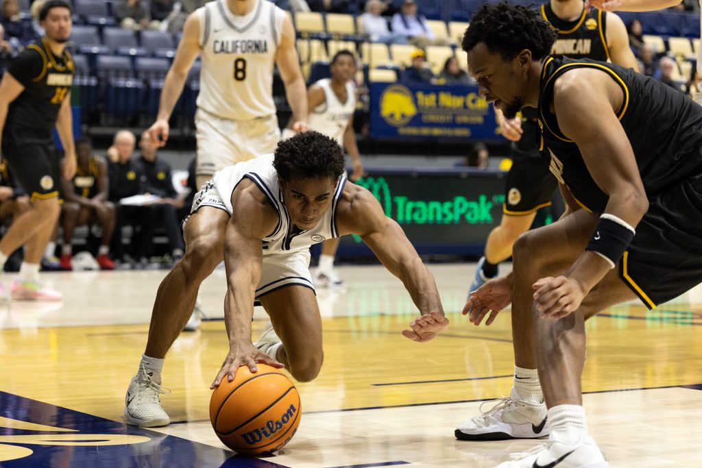 Dec 9, 2025; Berkeley, California, USA; California Golden Bears guard Semetri (TT) Carr (3) and Dominican Penguins forward Sargent Jeffery (22) both vie for the ball during the second half at Haas Pavilion. Mandatory Credit: D. Ross Cameron-Imagn Images