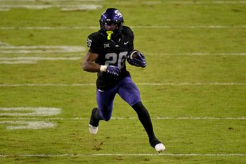 Nov 29, 2025; Fort Worth, Texas, USA; TCU Horned Frogs running back Jeremy Payne (26) runs with the ball during the game between the Horned Frogs and the Bearcats at Amon G. Carter Stadium. Mandatory Credit: Jerome Miron-Imagn Images