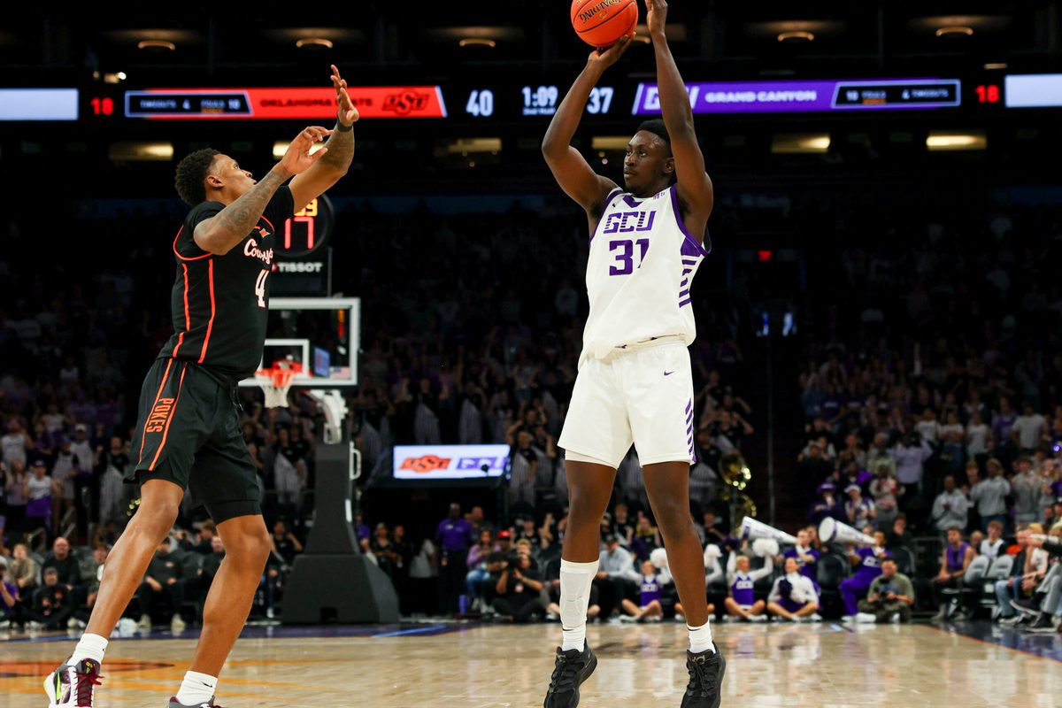 Dec 6, 2025; Phoenix, Arizona, USA; Grand Canyon University Antelopes forward Nana Owusu Anane (31) attempts a three-point shot against Oklahoma State University Cowboys guard Christian Coleman (4) in the first half at PHX Arena. Mandatory Credit: Anna Carrington-Imagn Images