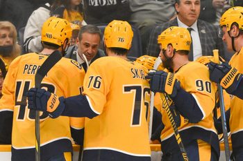 Dec 9, 2025; Nashville, Tennessee, USA;  Nashville Predators head coach Andrew Brunette talks with his team during a time out against the Colorado Avalanche during the third period at Bridgestone Arena. Mandatory Credit: Steve Roberts-Imagn Images