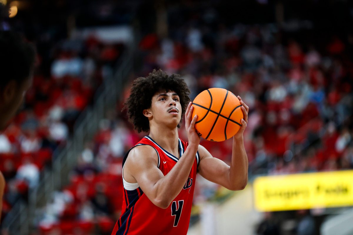 Dec 6, 2025; Raleigh, North Carolina, USA; Liberty Flames guard Brett Decker Jr. (4) shoots a free throw during the second half of the game against the NC State Wolfpack at Lenovo Center. Mandatory Credit: Jaylynn Nash-Imagn Images