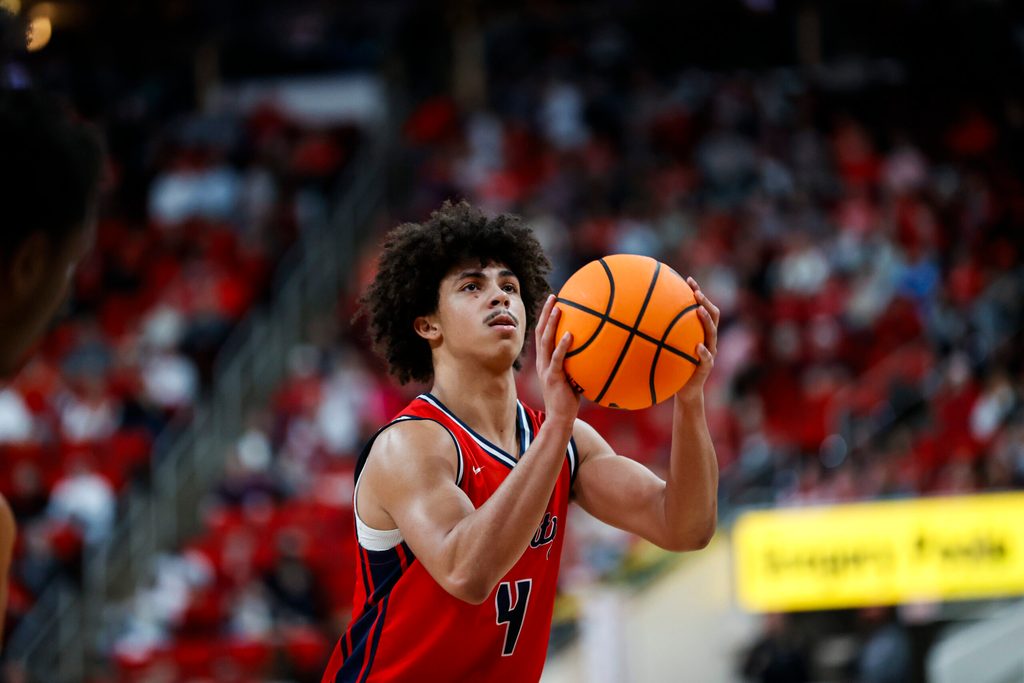 Dec 6, 2025; Raleigh, North Carolina, USA;
Liberty Flames guard Brett Decker Jr. (4) shoots a free throw during the second half of the game against the NC State Wolfpack at Lenovo Center. Mandatory Credit: Jaylynn Nash-Imagn Images