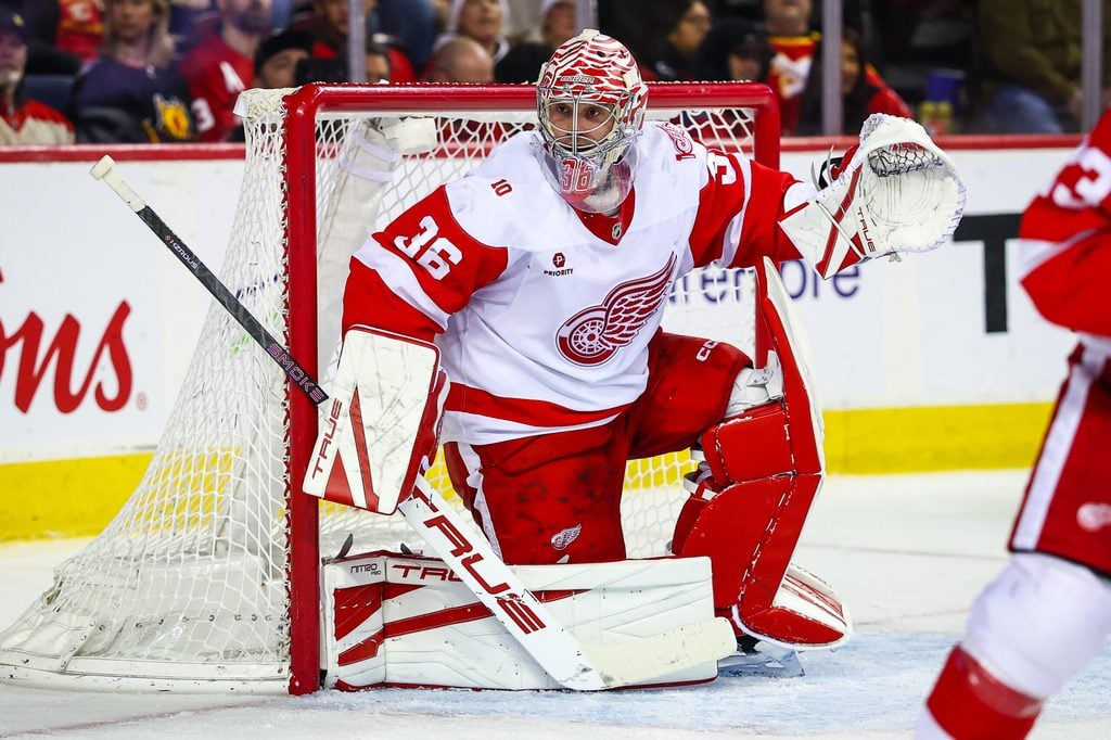 Dec 10, 2025; Calgary, Alberta, CAN; Detroit Red Wings goaltender John Gibson (36) guards his net against the Calgary Flames during the second period at Scotiabank Saddledome. Mandatory Credit: Sergei Belski-Imagn Images