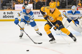 Dec 11, 2025; Nashville, Tennessee, USA;  Nashville Predators center Fedor Svechkiv (40) skates with the puck against the St. Louis Blues during the first period at Bridgestone Arena. Mandatory Credit: Steve Roberts-Imagn Images