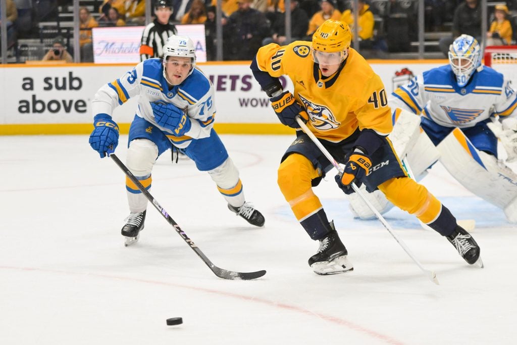 Dec 11, 2025; Nashville, Tennessee, USA; Nashville Predators center Fedor Svechkiv (40) skates with the puck against the St. Louis Blues during the first period at Bridgestone Arena. Mandatory Credit: Steve Roberts-Imagn Images