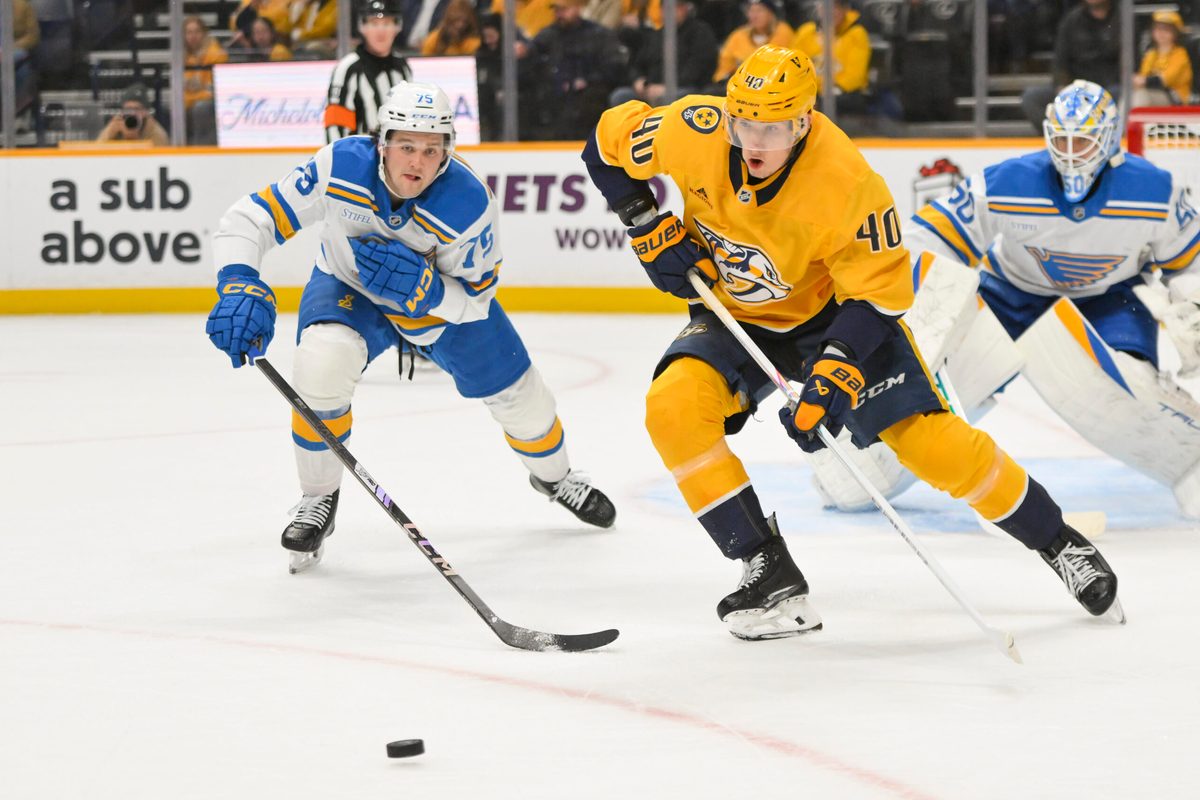 Dec 11, 2025; Nashville, Tennessee, USA; Nashville Predators center Fedor Svechkiv (40) skates with the puck against the St. Louis Blues during the first period at Bridgestone Arena. Mandatory Credit: Steve Roberts-Imagn Images