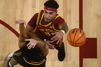 Iowa State Cyclones guard Tamin Lipsey (3) shoots the ball over Iowa Hawkeyes guard Kael Combs (11) during the first half in the men’s basketball Cy-Hawk series on Dec. 11, 2025, in Ames, Iowa.