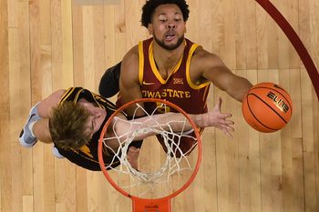 Iowa State Cyclones forward Joshua Jefferson (5) goes for a layup around Iowa Hawkeyes forward Cooper Koch (8) during the first half in the men’s basketball Cy-Hawk series on Dec. 11, 2025, in Ames, Iowa.